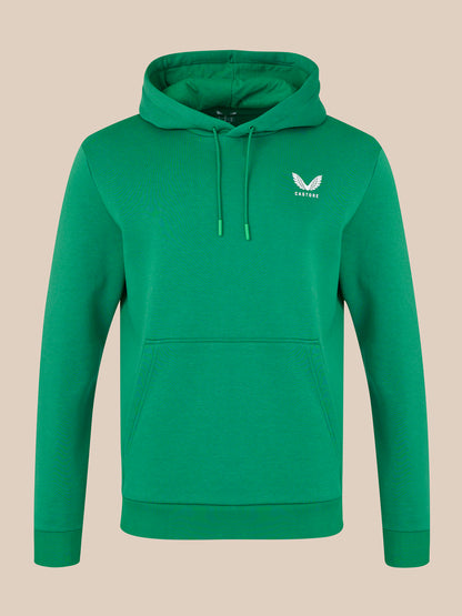 Green hoodie with a logo on a beige background