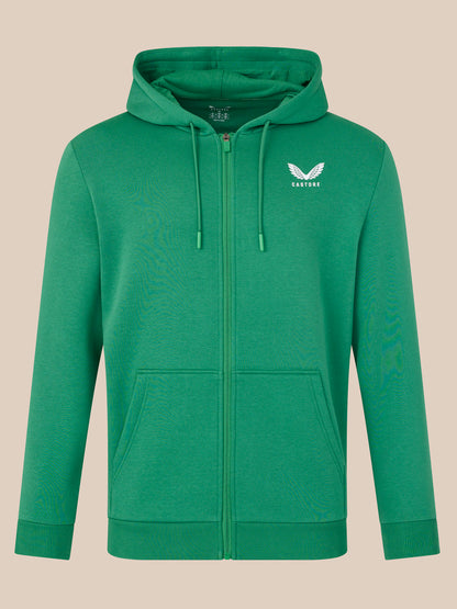 Green hoodie with a logo on a beige background