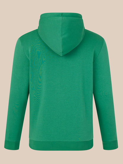 Green hoodie on a beige background