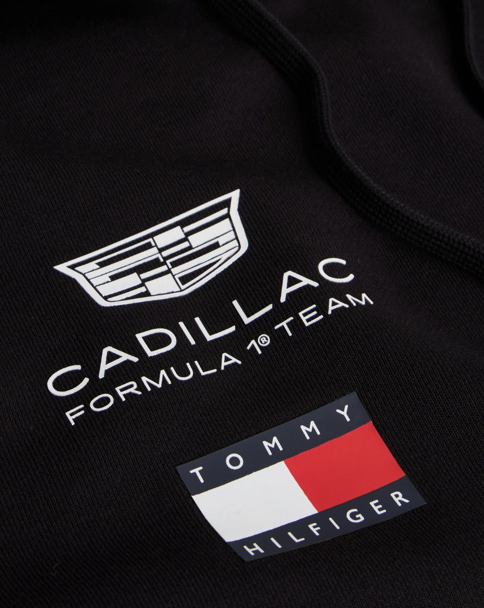 Black hoodie featuring Cadillac Formula 1 Team logo and Tommy Hilfiger flag emblem on fabric