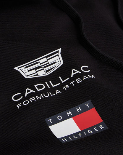 Black hoodie featuring Cadillac Formula 1 Team logo and Tommy Hilfiger flag emblem on fabric