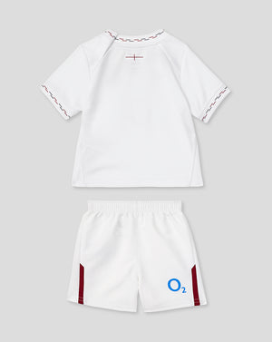 White sports outfit with maroon accents on a light gray background