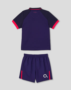 Navy sports outfit with red accents on a light gray background