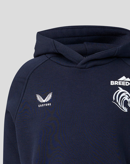 Chest close up on navy Travel Hoodie showing Castore logo and Breedon crest.