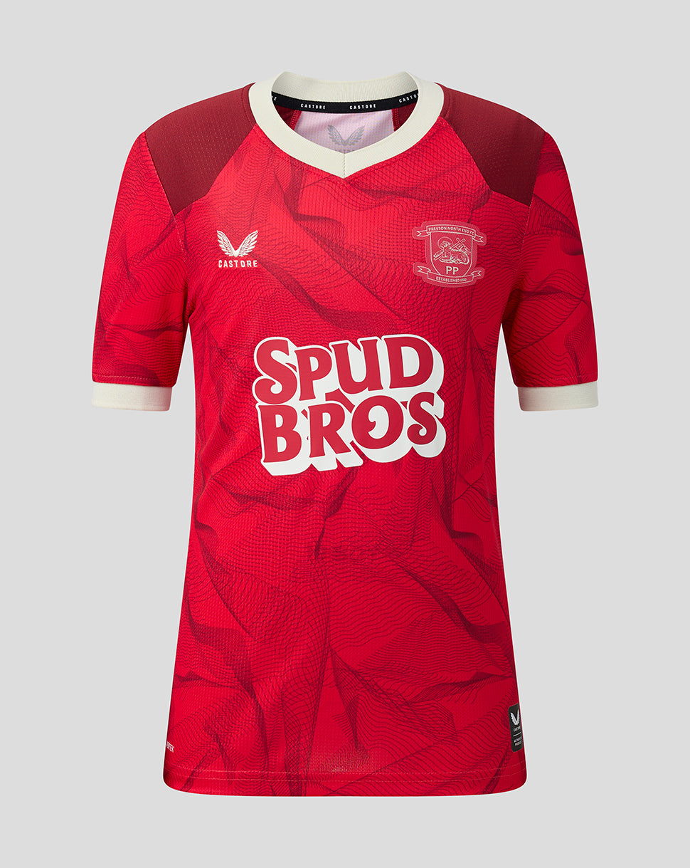 A red short-sleeve football jersey with a subtle tonal pattern, featuring a white V-neck collar, white cuffs, the Easton logo on the right chest, the PNE crest on the left chest, and 'SPUD BROS' printed across the front in white and red.