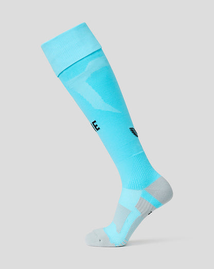 Light blue knee-high sock with brand logos on a gray background