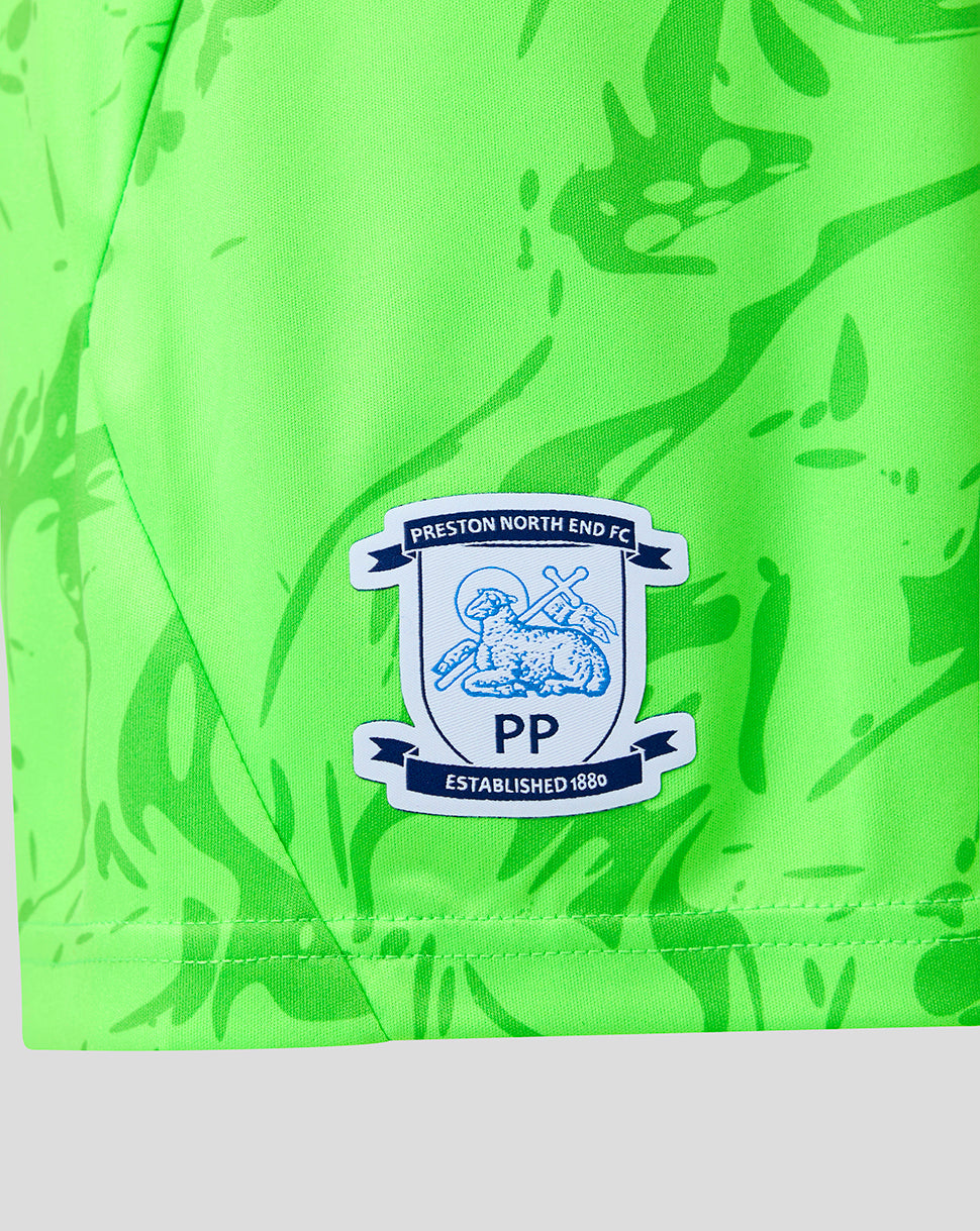 Close-up of neon green Preston North End Junior 26/27 third goalkeeper shorts showing the club crest badge on the leg