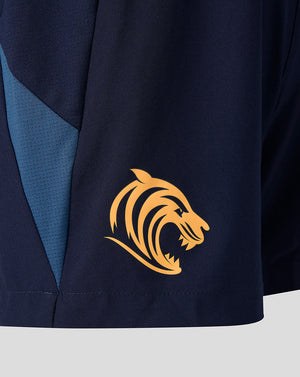 Side view of navy training shorts with blue side panels and a gold tiger crest on the lower left leg.