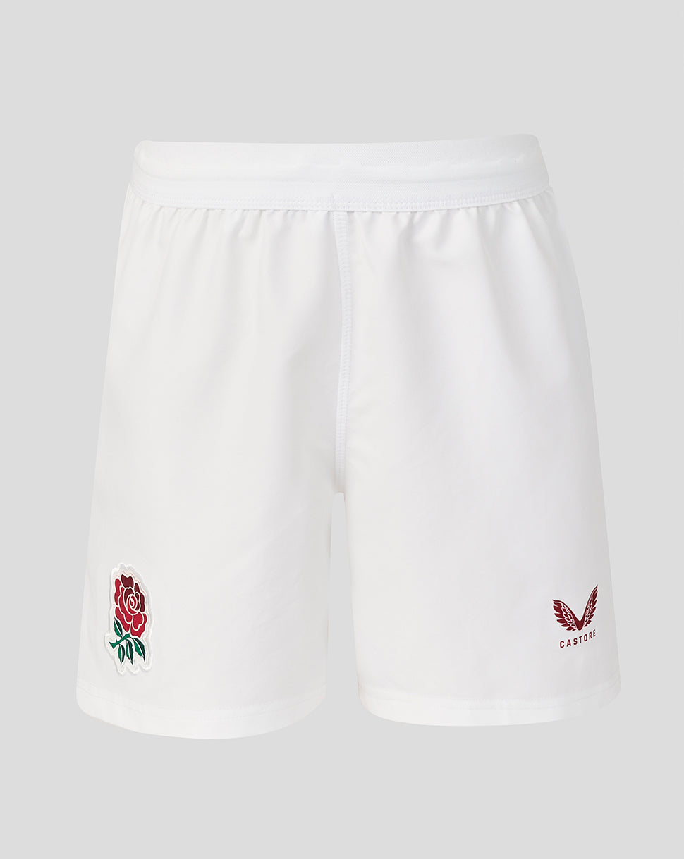 White shorts with embroidered rose and eagle design on a light gray background