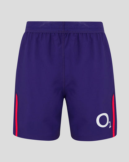 Blue shorts with red accents and a logo on a gray background