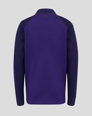 Purple long-sleeve shirt with a small red logo on the chest against a light gray background