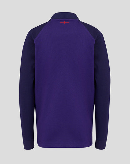 Purple long-sleeve shirt with a small red logo on the chest against a light gray background