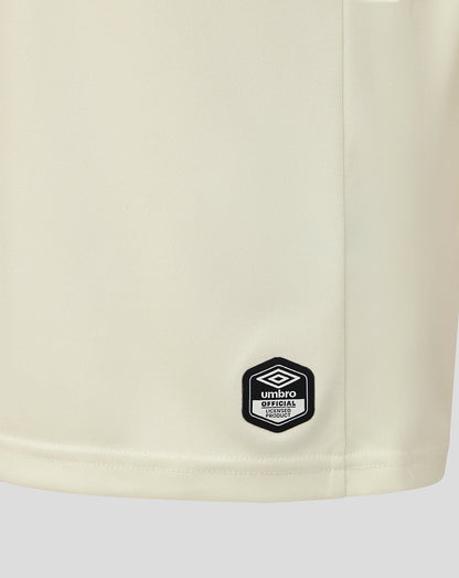 Beige shorts with a black Umbro logo on a white background