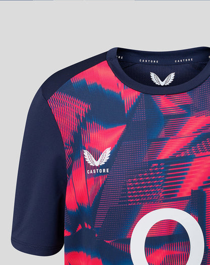 Navy and pink sports jersey with 'Castore' branding on a light gray background