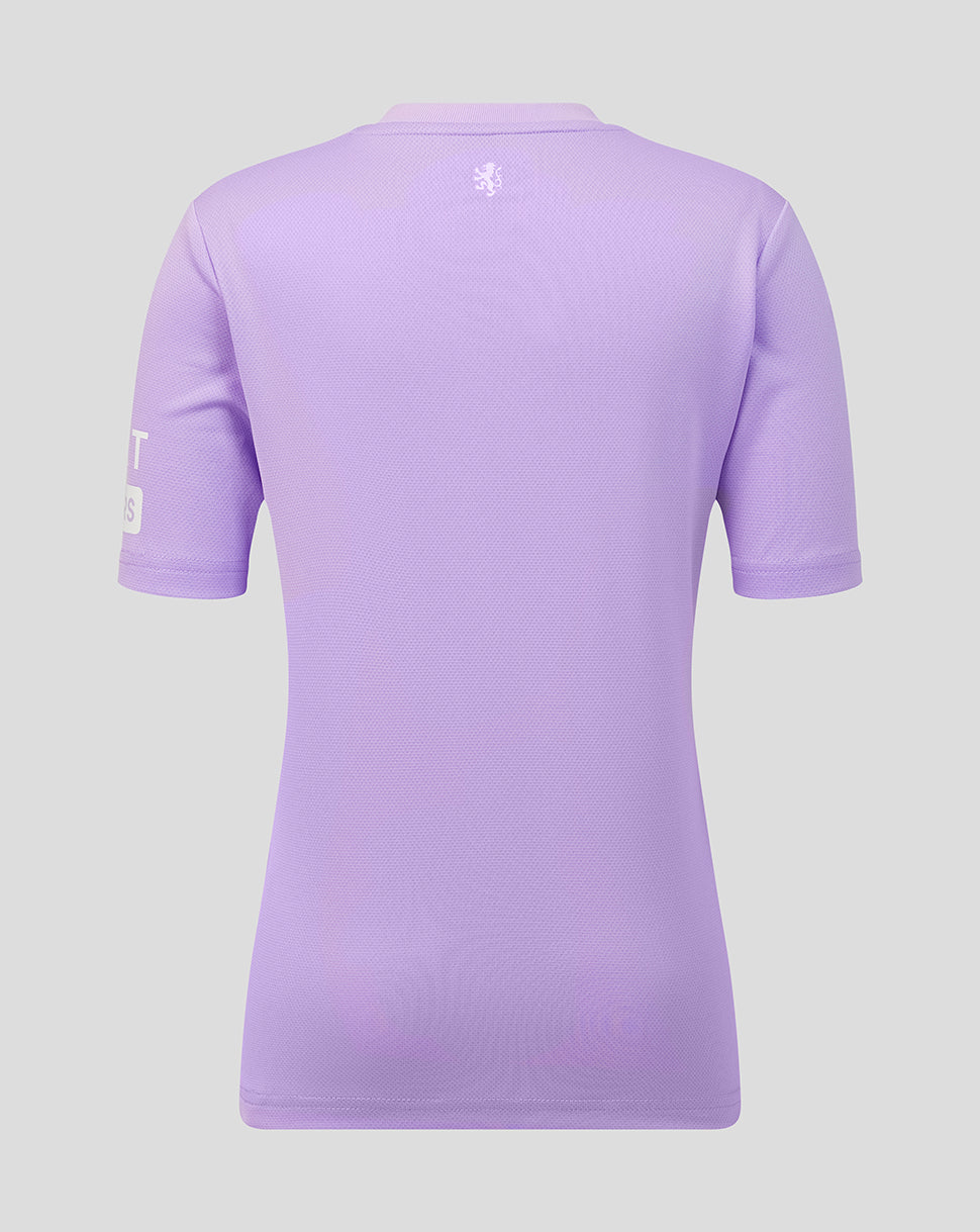 A light purple short-sleeve athletic jersey shown from the back, featuring a small white crest logo centered below the collar and a white letter patch on the left sleeve, set against a solid light gray background.
