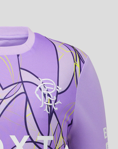 Close-up of a purple athletic jersey with a white stylized Rangers logo on the chest, abstract black and yellow line graphics, and a light gray background.