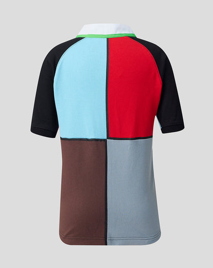 Color-blocked polo shirt with black, blue, red, brown, and gray sections on a light gray background.