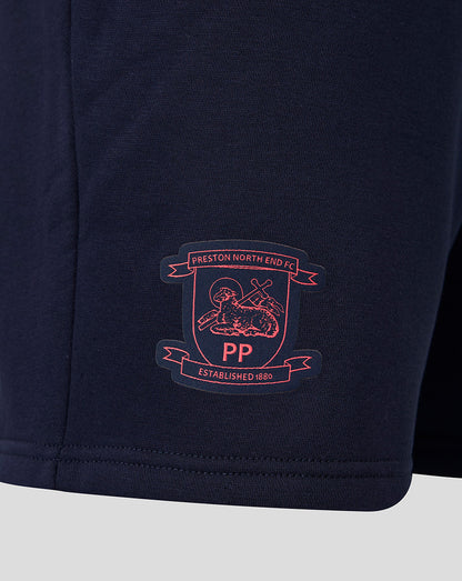 Navy blue shorts with a embroidered logo on a light gray background