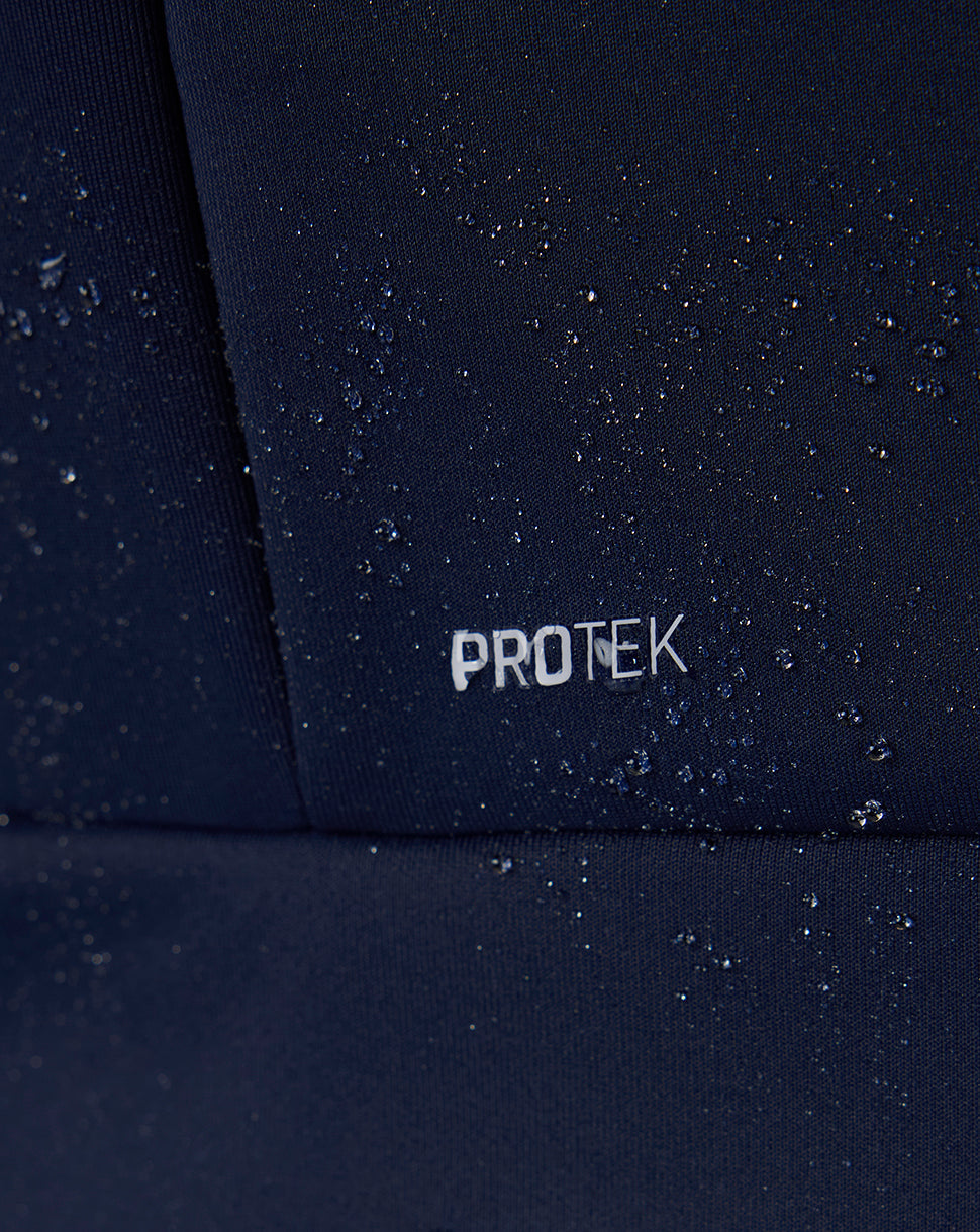 Close-up of a dark surface with 'PROTEK' branding.