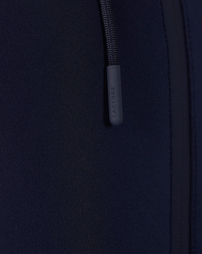 Close-up of navy Travel Flex Hoodie zipper area with Castore branded pull tab