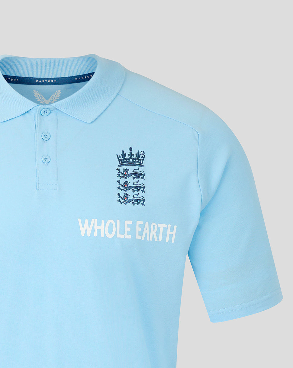 Light blue polo shirt with a logo and 'Whole Earth' text on a light gray background