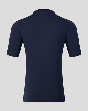 Navy blue polo shirt on a light gray background