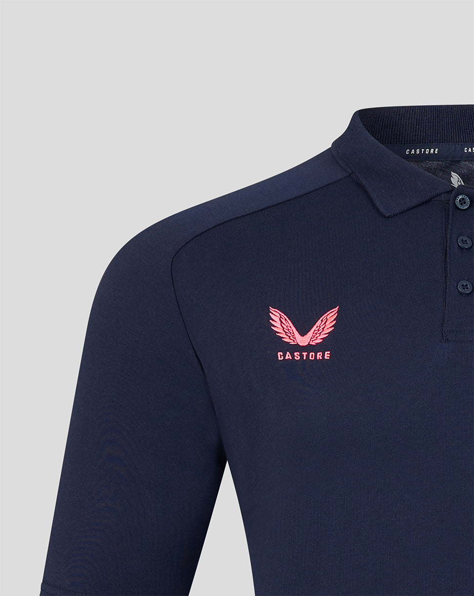 Navy blue polo shirt with a pink logo on a light gray background