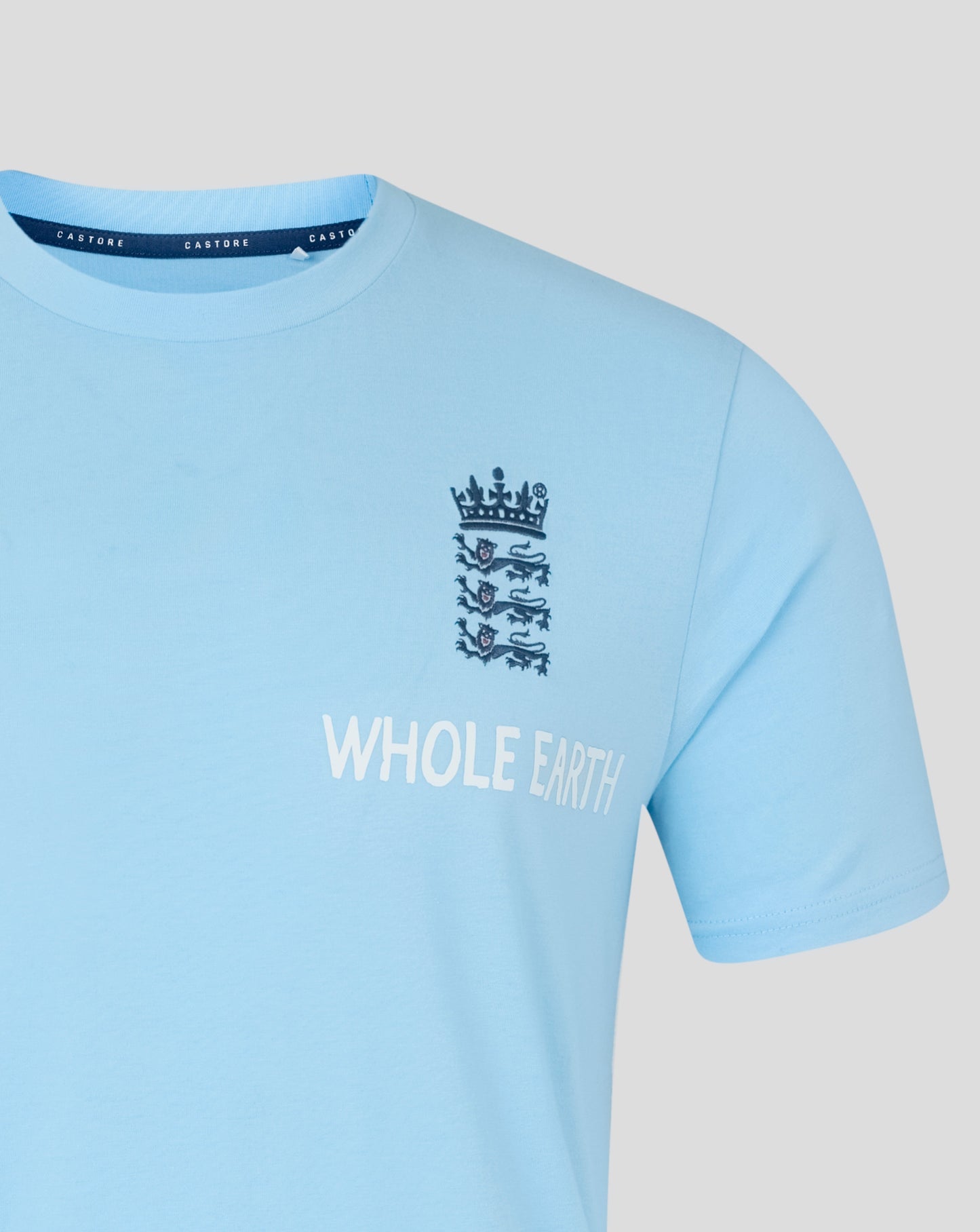Light blue t-shirt with a logo and text on a gray background