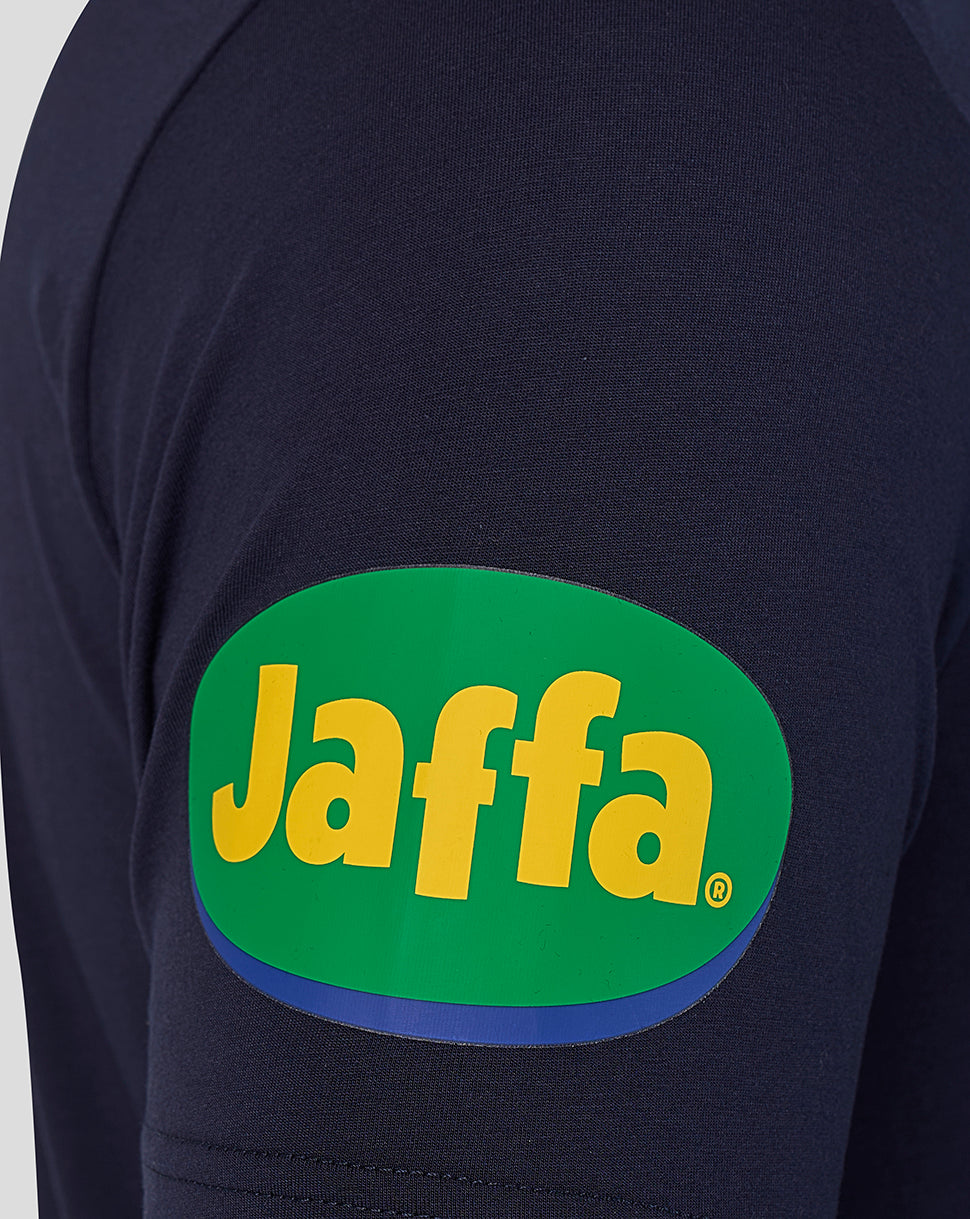 Blue training vest sleeve with a green oval Jaffa logo in yellow on the patch.