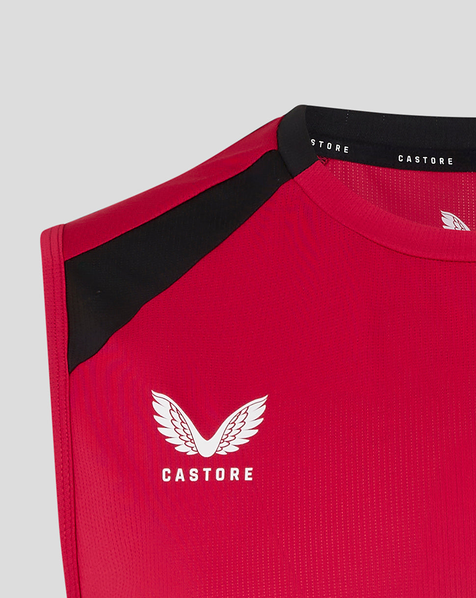 Red athletic shirt with black sleeves and Castore logo on a light gray background