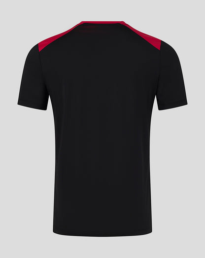 Black t-shirt with red accents on a gray background