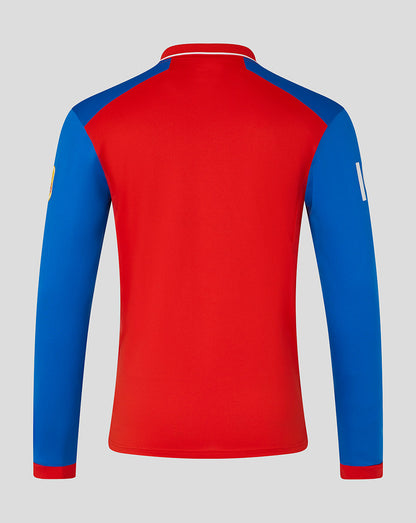Red and blue long-sleeve shirt on a gray background