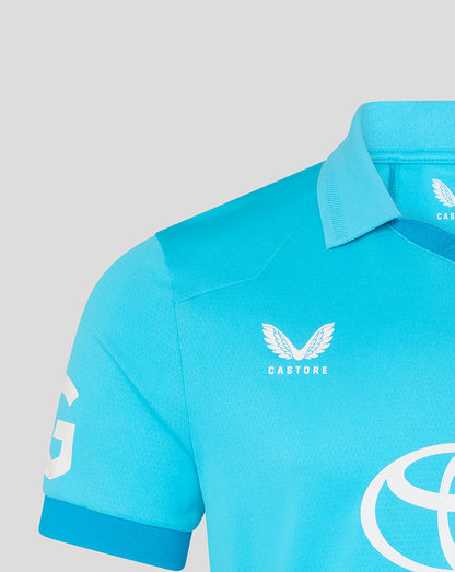 Light blue polo shirt with 'Castore' branding on a gray background