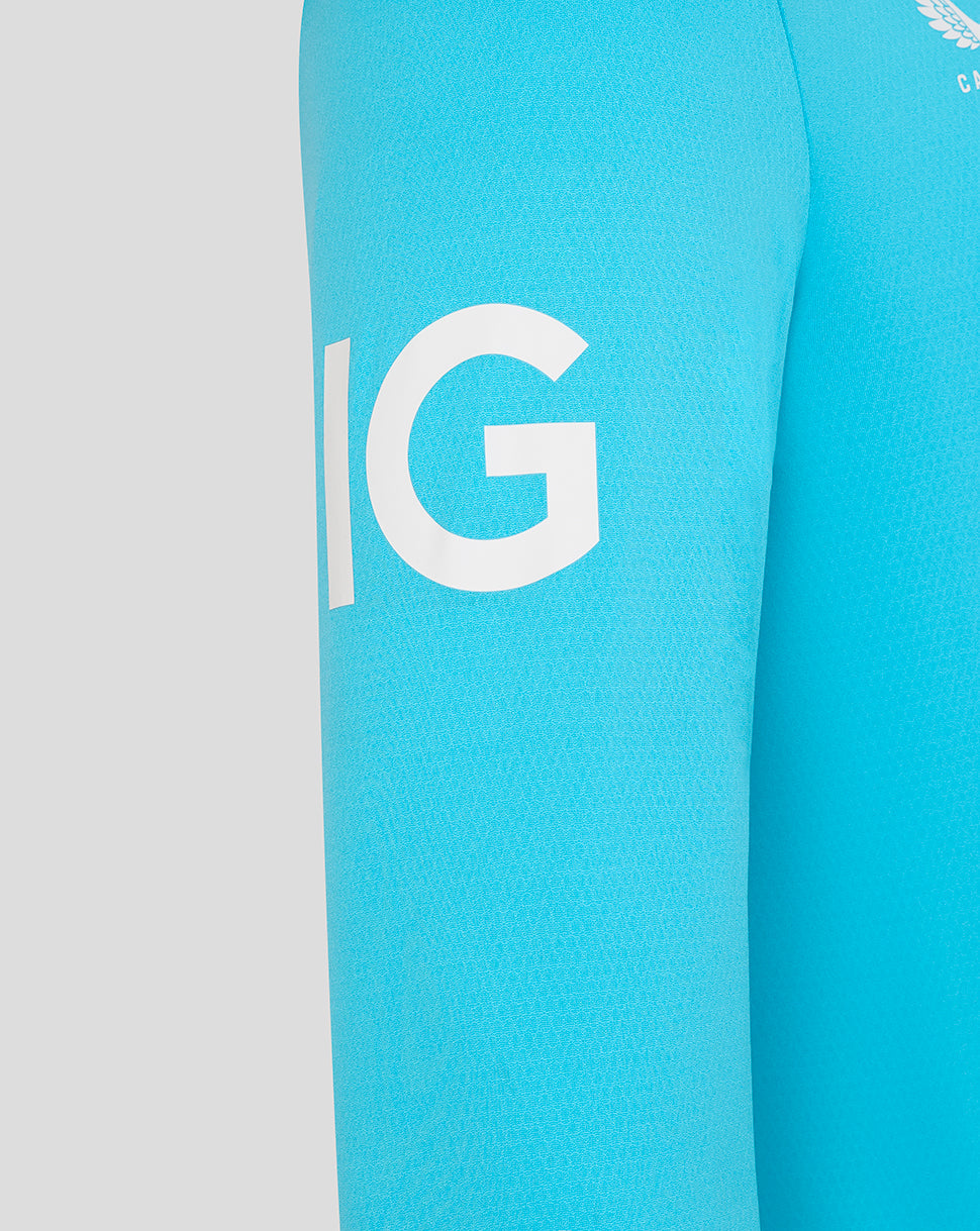 Close-up of a blue sleeve with a white logo on a gray background