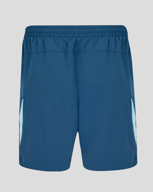 Blue athletic shorts on a gray background