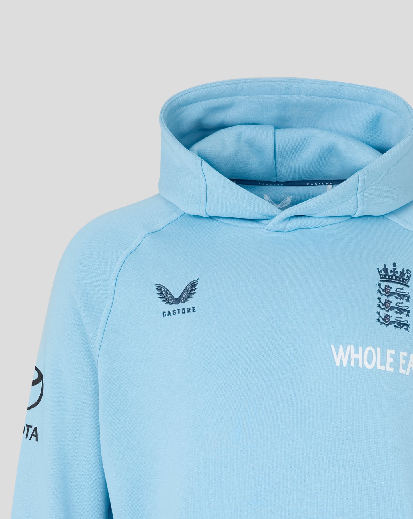 Light blue hoodie with branding on a gray background