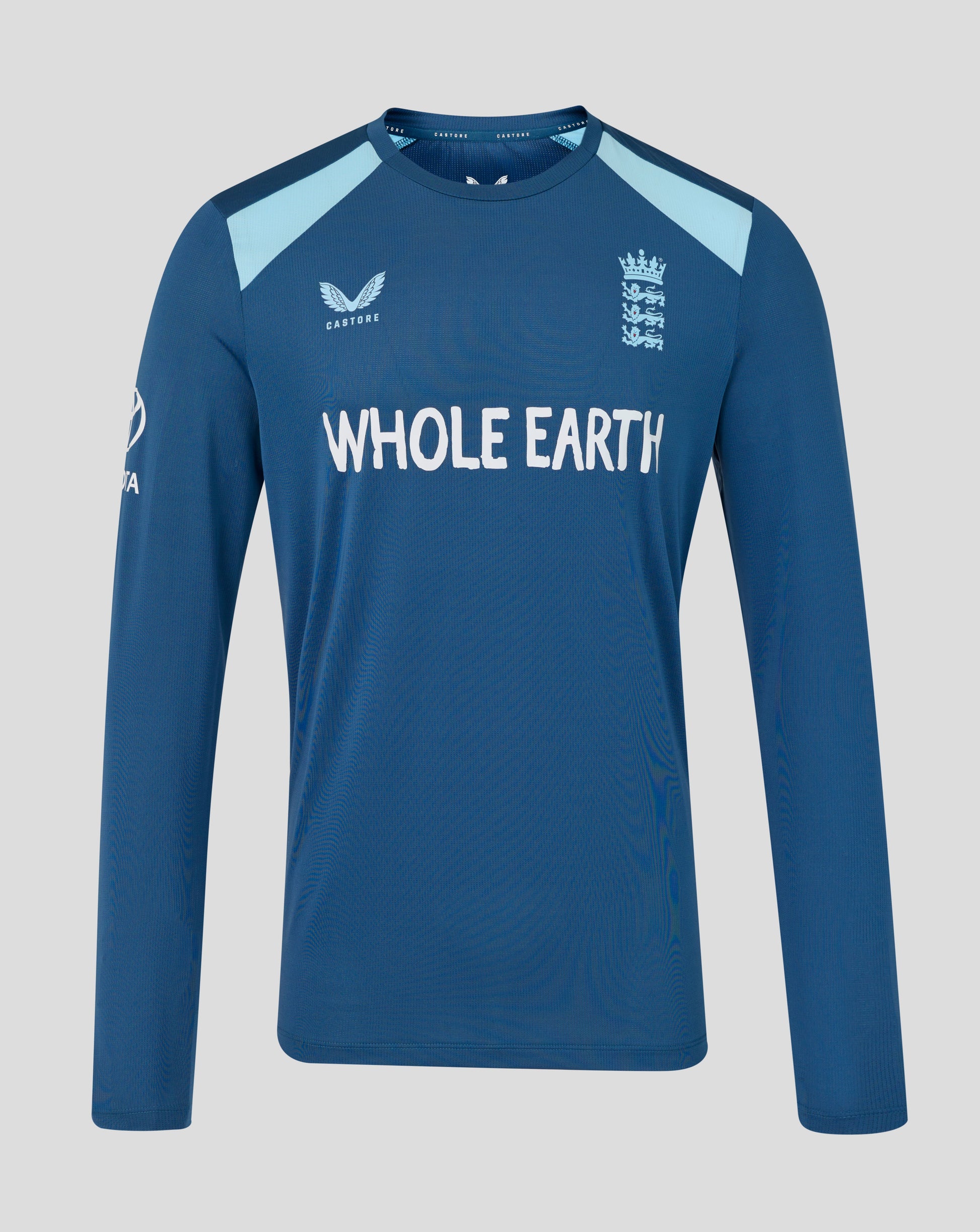 Blue long-sleeve shirt with 'Whole Earth' branding on a gray background