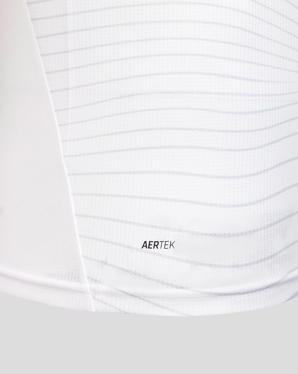 Close-up of a white shirt with 'AERTEK' branding.