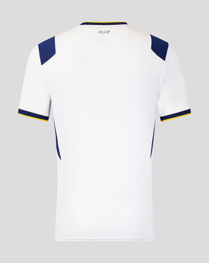 White sports jersey with blue and yellow accents on a gray background