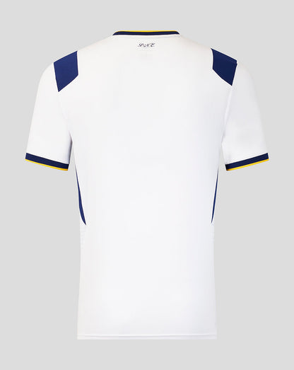 White sports jersey with blue and yellow accents on a gray background