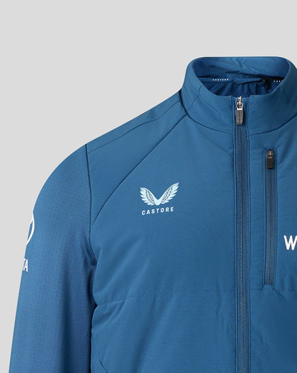 Blue jacket with 'Castore' logo on a gray background