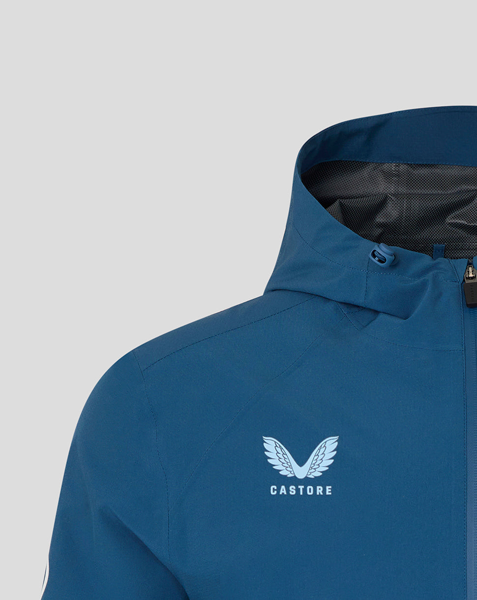 Blue jacket with a visible brand logo on a light gray background