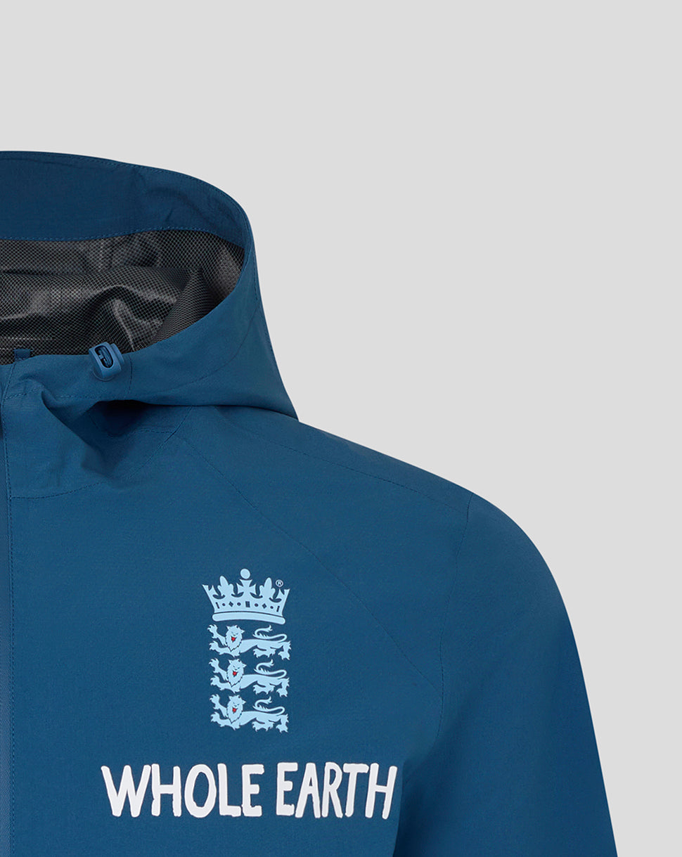 Blue jacket with 'Whole Earth' logo on a light gray background