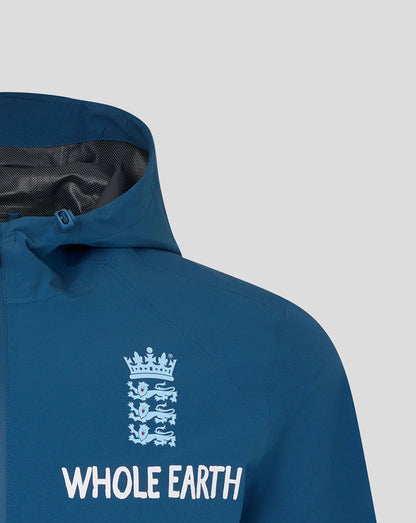 Blue jacket with 'Whole Earth' logo on a light gray background