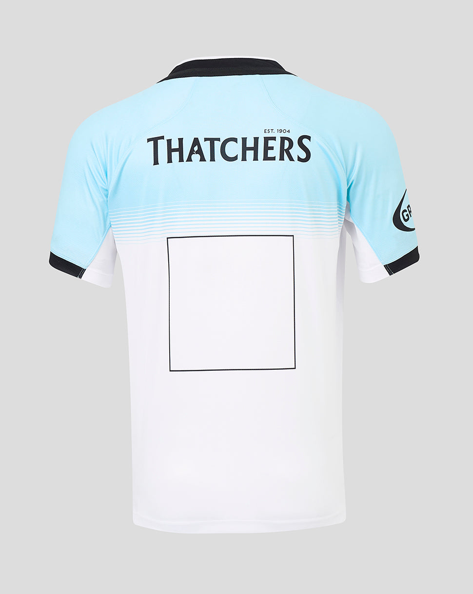 Back view of Bath Rugby away replica shirt with Thatchers branding across the upper back and light blue to white gradient.