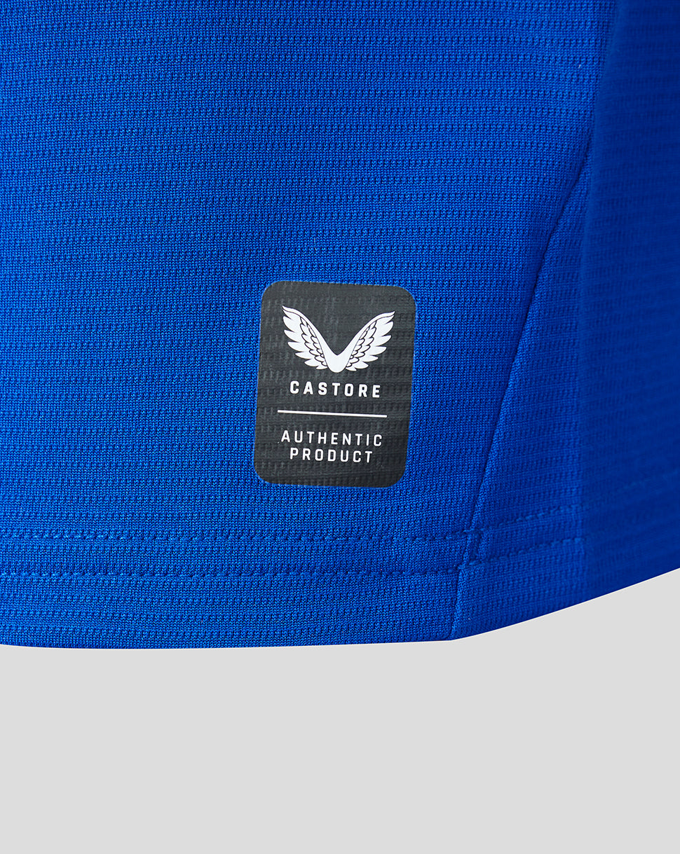 Blue athletic shirt with a Castore label on a white background