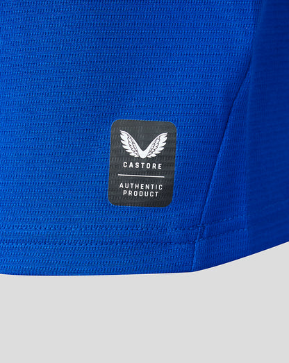 Blue athletic shirt with a Castore label on a white background