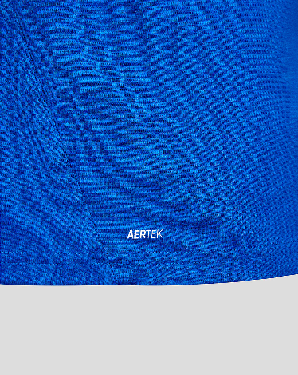 Close-up of a blue fabric with 'AERTEK' branding on a gray background