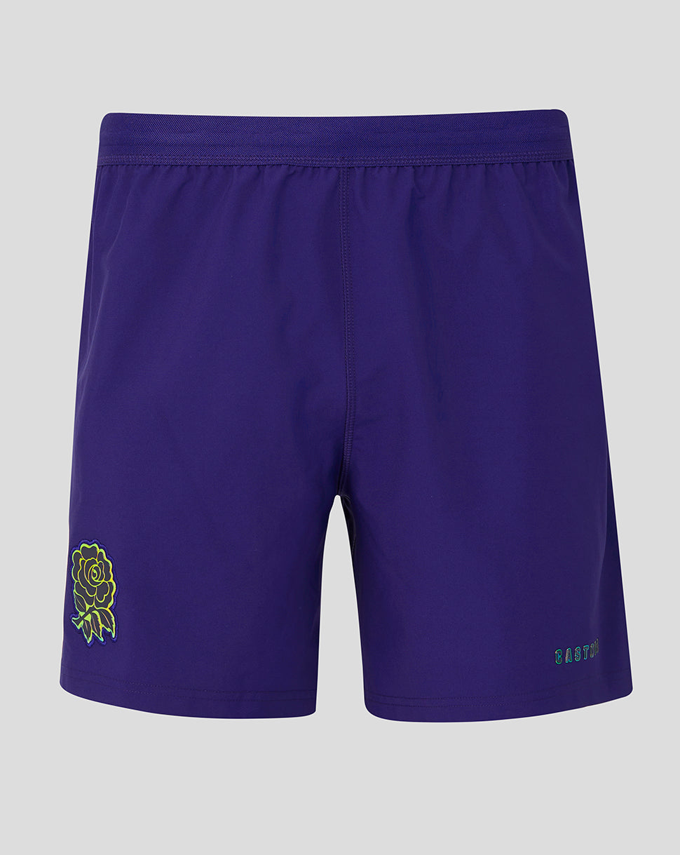 Purple shorts with a green logo on a gray background