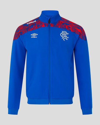 A royal blue track jacket with red patterned shoulder panels, featuring the Umbro logo and Rangers FC crest on the chest, displayed against a neutral gray background.